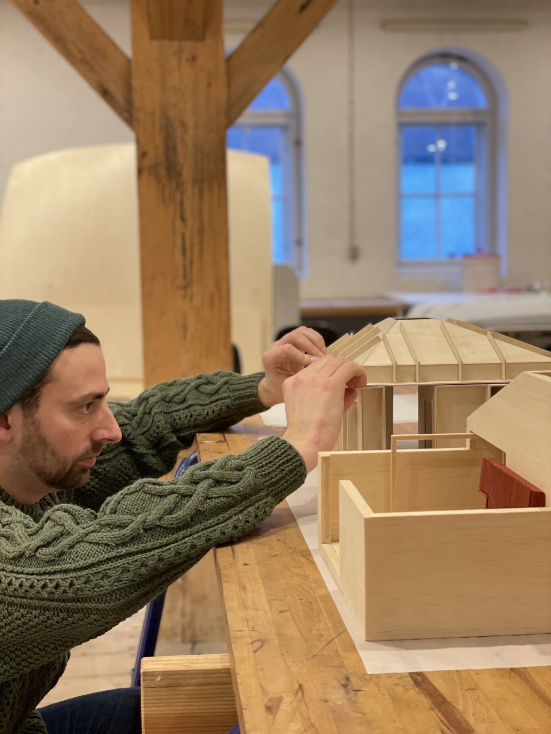 Postdoc at STAY HOME Nichols Thomas Lee building 3D model in wood of houses.